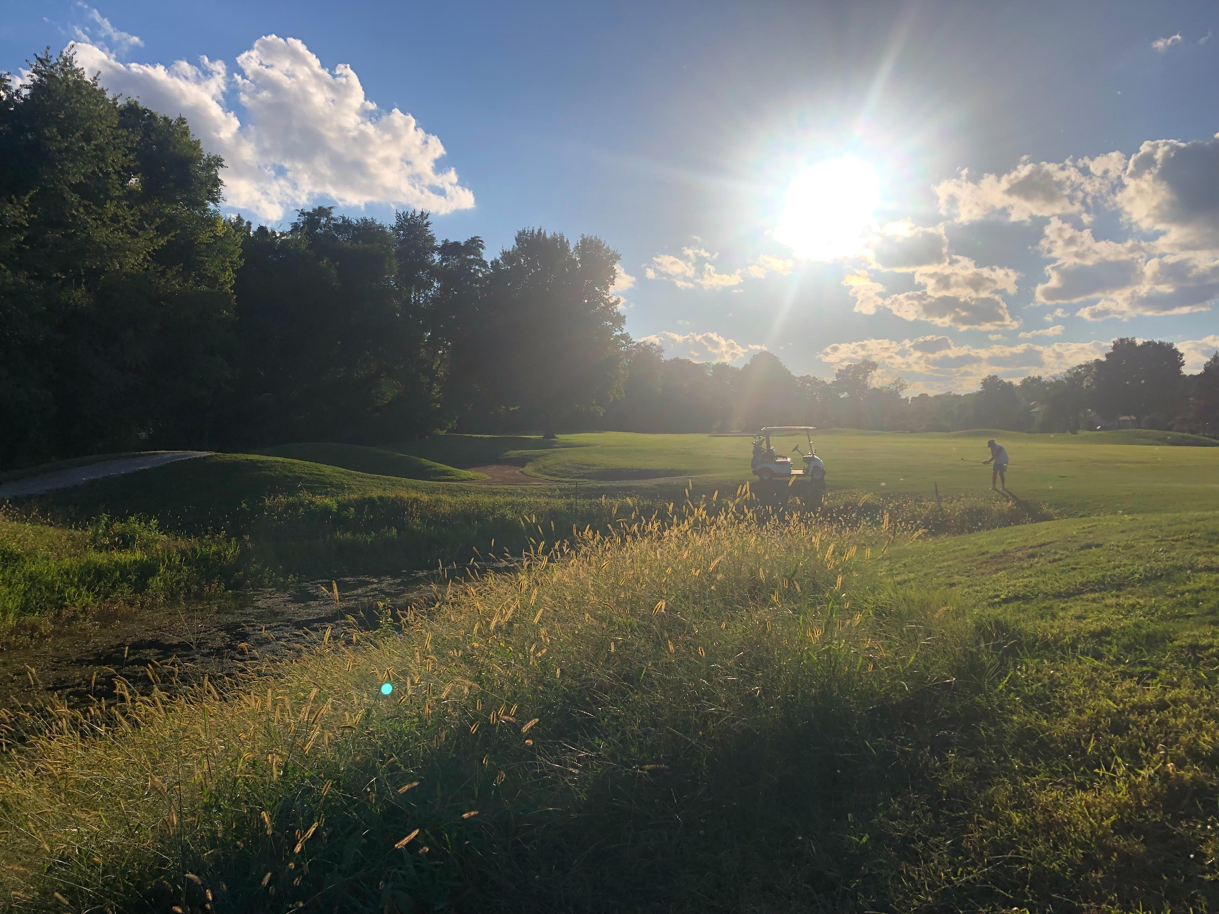 Sun lighting the golf course overlooking the lakes